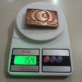 8 Ball Las Vegas A Winner vintage belt buckle – on scale showing weight