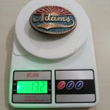 Adams Trucking vintage belt buckle – on scale showing weight