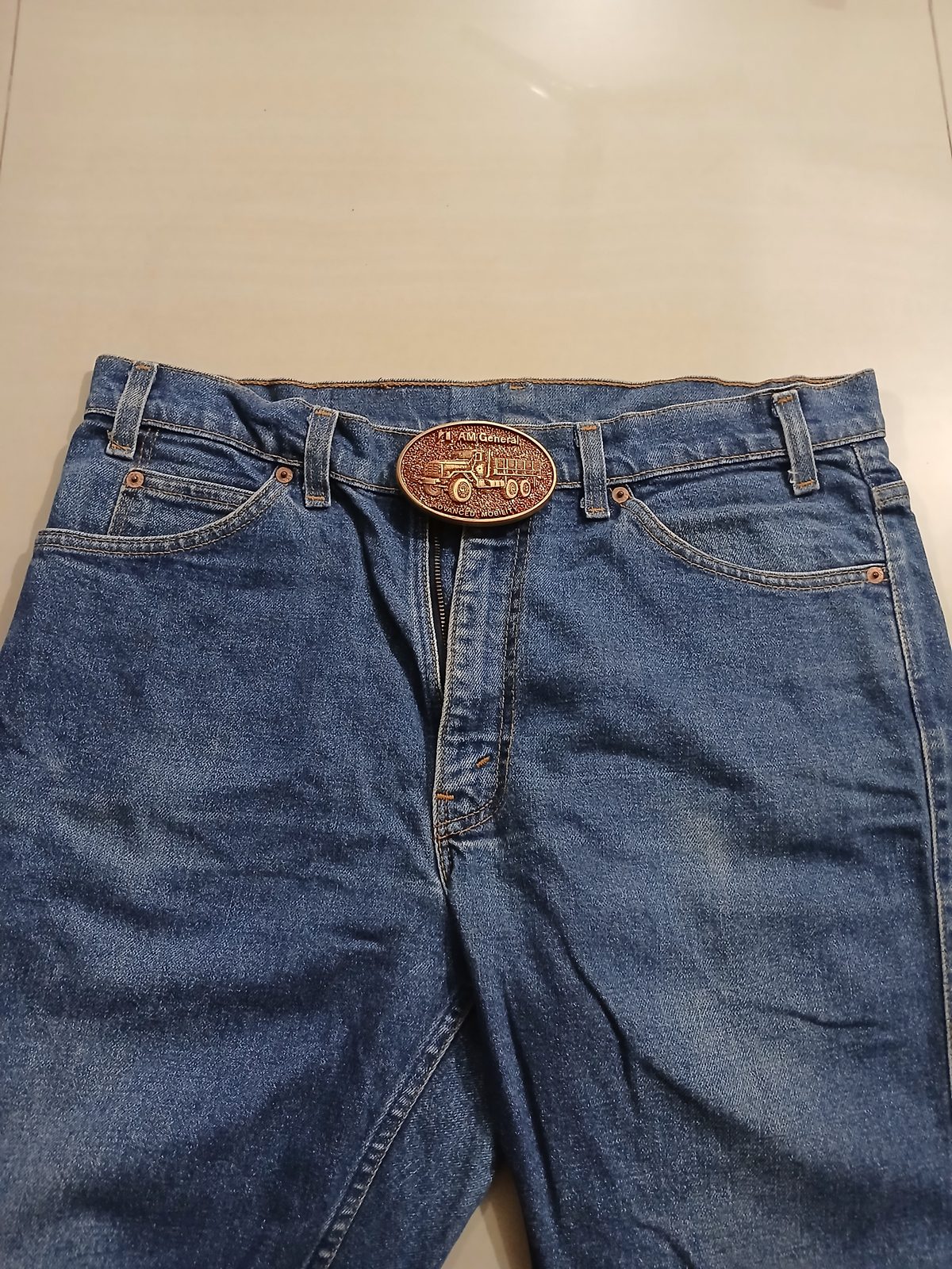 AM General Advanced Mobility Vintage Belt Buckle – Worn on belt with jeans AM General Advanced Mobility vintage belt buckle – worn on belt with jeans