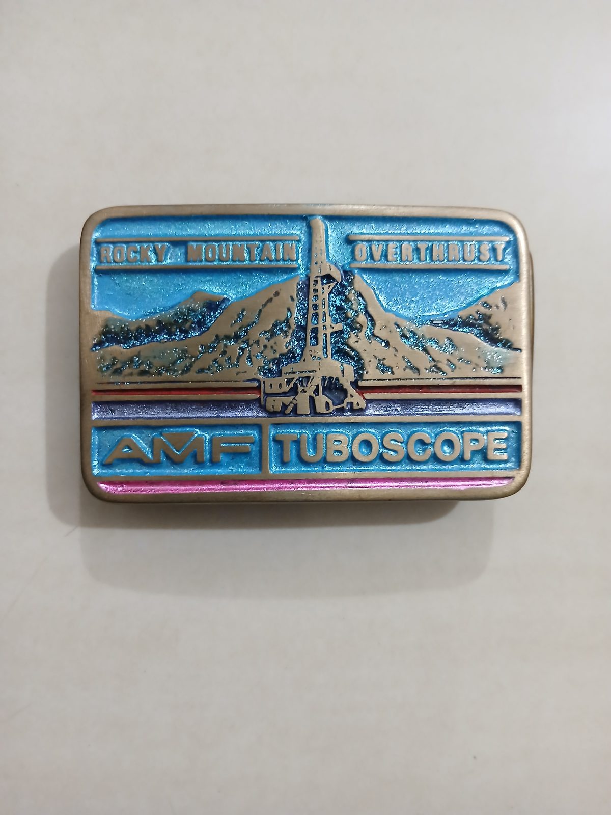 AMF Tuboscope Vintage Belt Buckle – Front view AMF Tuboscope vintage belt buckle – front view