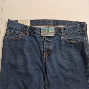 AMF Tuboscope vintage belt buckle – worn on belt with jeans