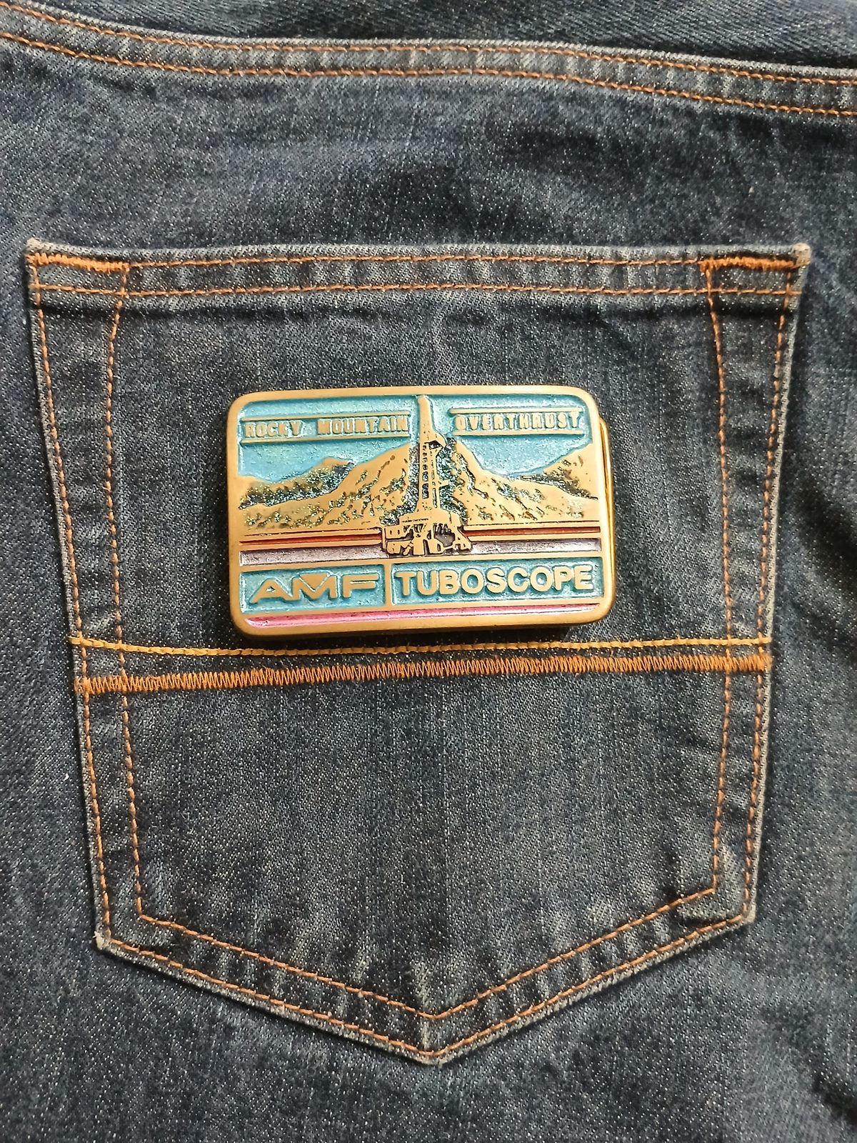 AMF Tuboscope Vintage Belt Buckle – On jeans back pocket AMF Tuboscope vintage belt buckle – on jeans back pocket