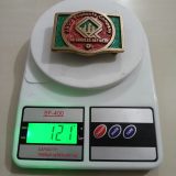 ARCO Los Angeles Refinery vintage belt buckle – on scale showing weight