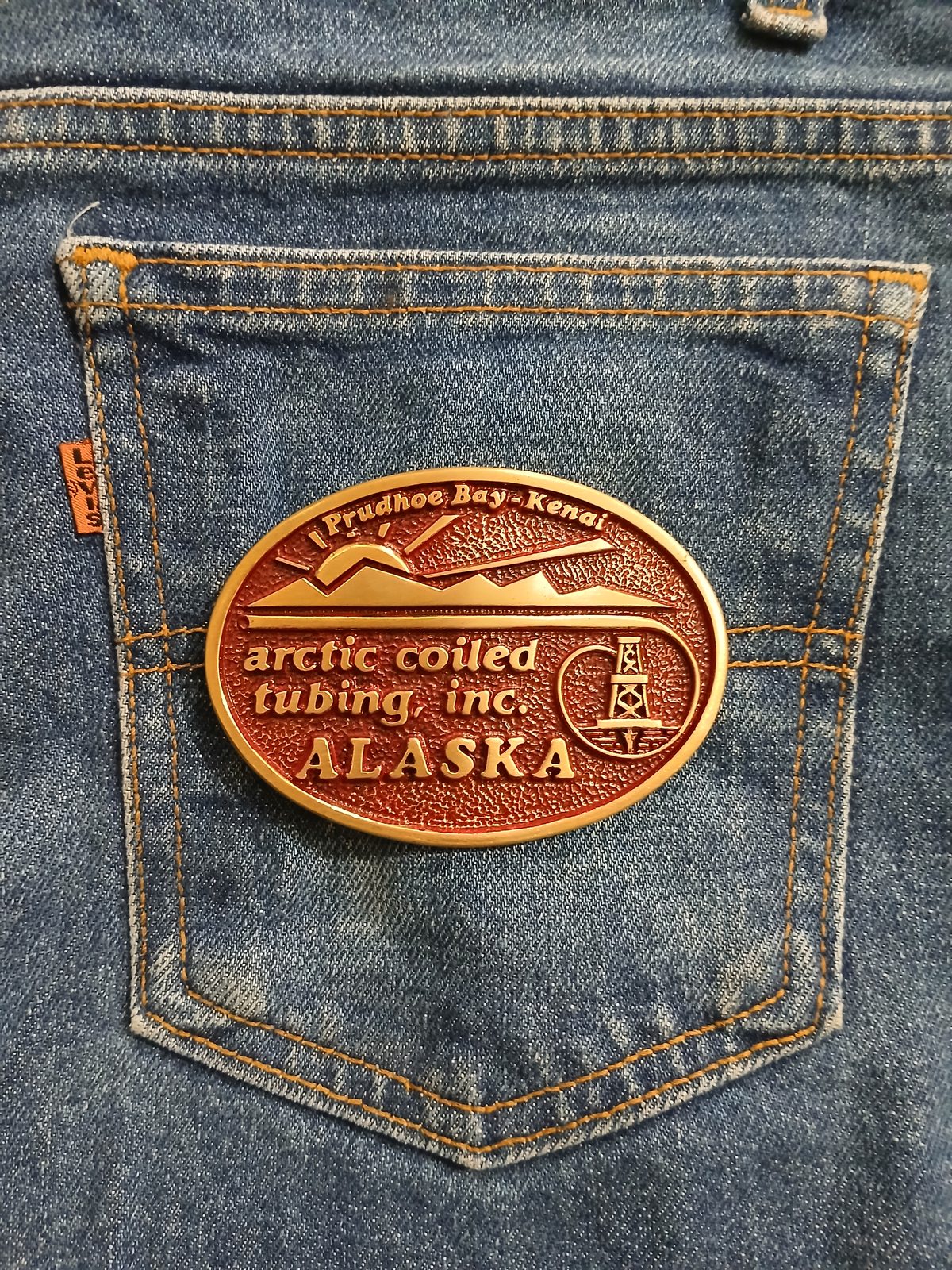 Arctic Coiled Tubing Inc Alaska Vintage Belt Buckle – On jeans back pocket Arctic Coiled Tubing Inc Alaska vintage belt buckle – on jeans back pocket