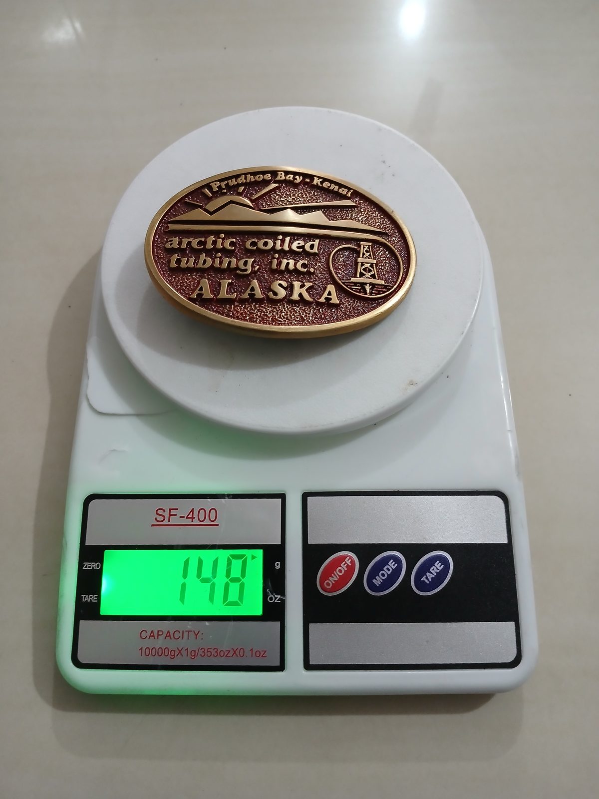 Arctic Coiled Tubing Inc Alaska Vintage Belt Buckle – On scale showing weight Arctic Coiled Tubing Inc Alaska vintage belt buckle – on scale showing weight