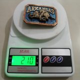 Arkansas Razorback vintage belt buckle – on scale showing weight