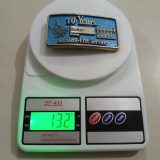 Baker Energy 10 Years Accident-Free vintage belt buckle – on scale showing weight
