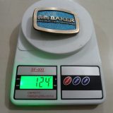 Baker Production Services vintage belt buckle – on scale showing weight