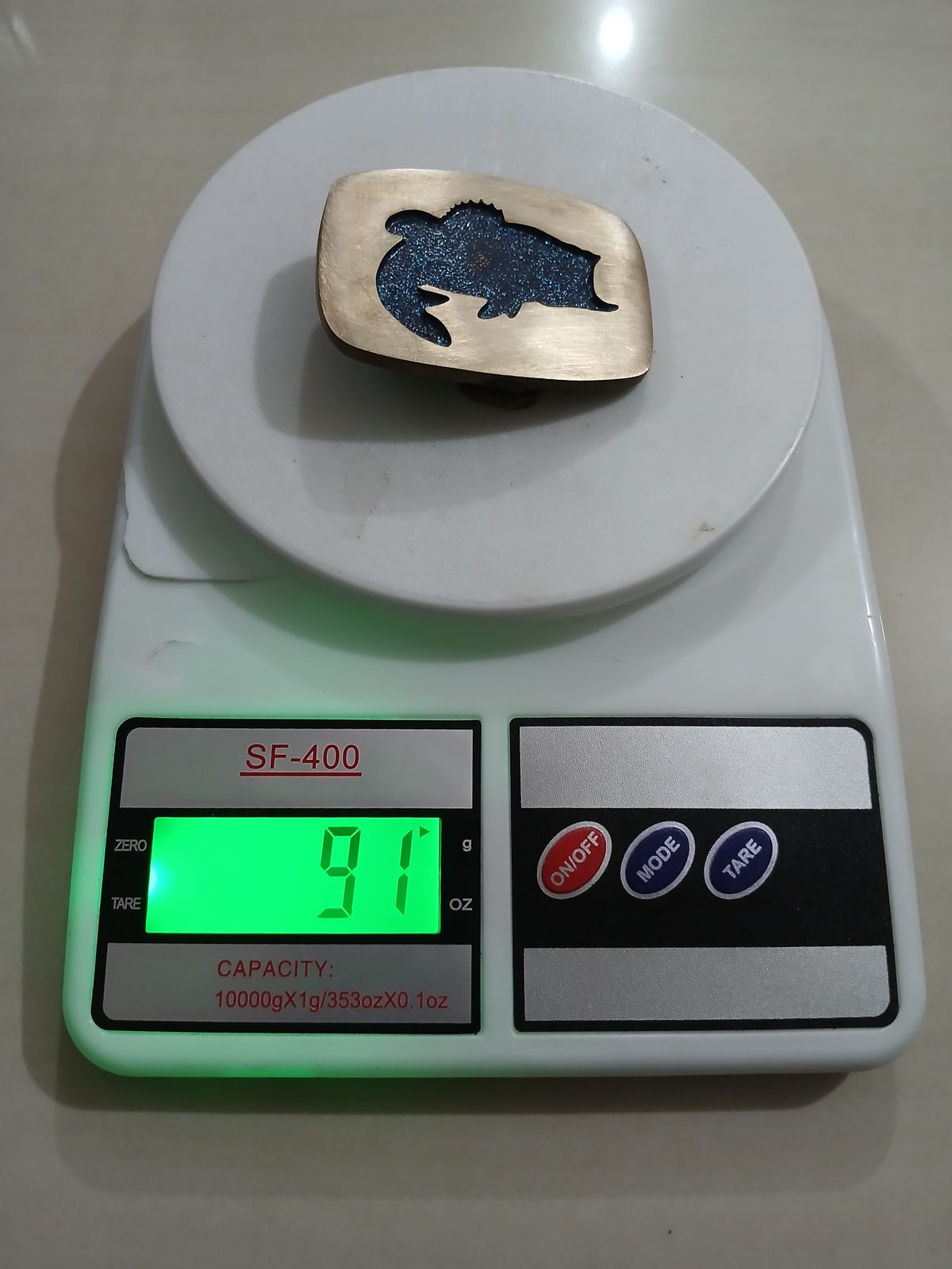 Bass Fish Cutout Vintage Belt Buckle – On scale showing weight Bass Fish Cutout vintage belt buckle – on scale showing weight