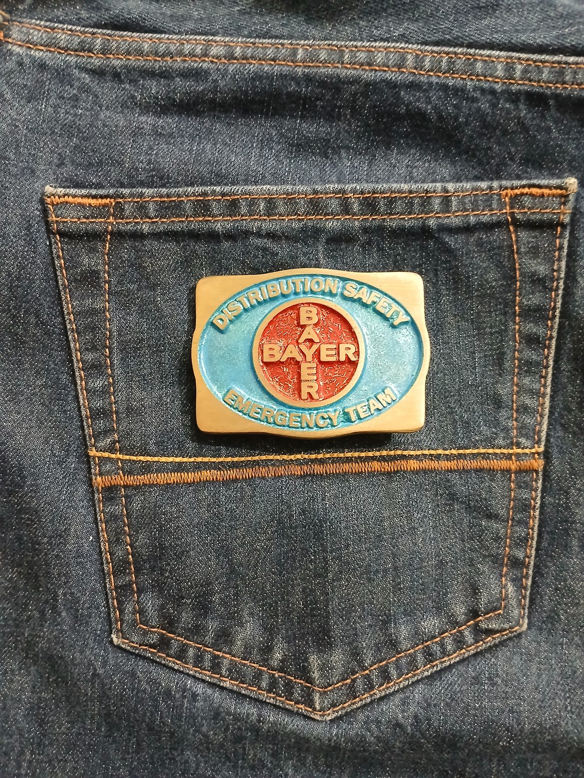 Bayer Emergency Team Vintage Belt Buckle – On jeans back pocket Bayer Emergency Team vintage belt buckle – on jeans back pocket