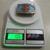 Bayer Emergency Team vintage belt buckle – on scale showing weight