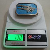Biplane vintage belt buckle – on scale showing weight