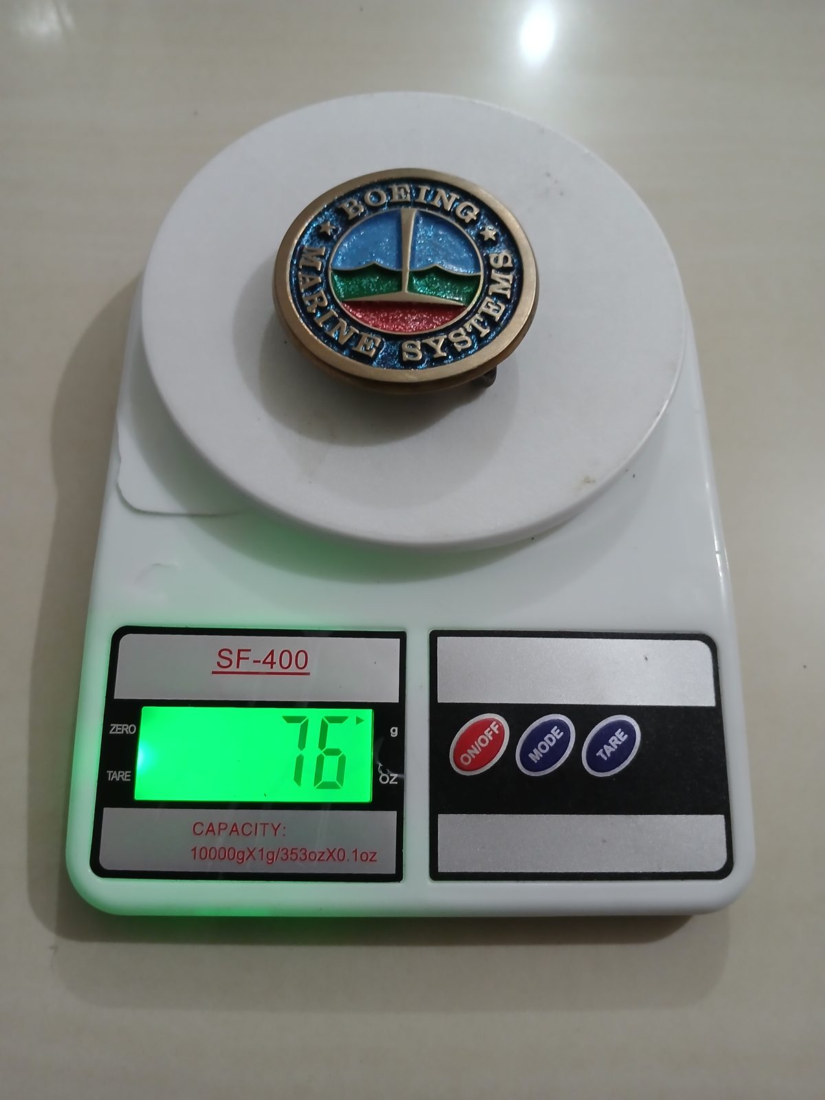 Boeing Marine Systems Vintage Belt Buckle – On scale showing weight Boeing Marine Systems vintage belt buckle – on scale showing weight