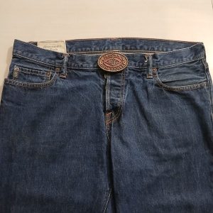 BOT Oil Tools vintage belt buckle – worn on belt with jeans