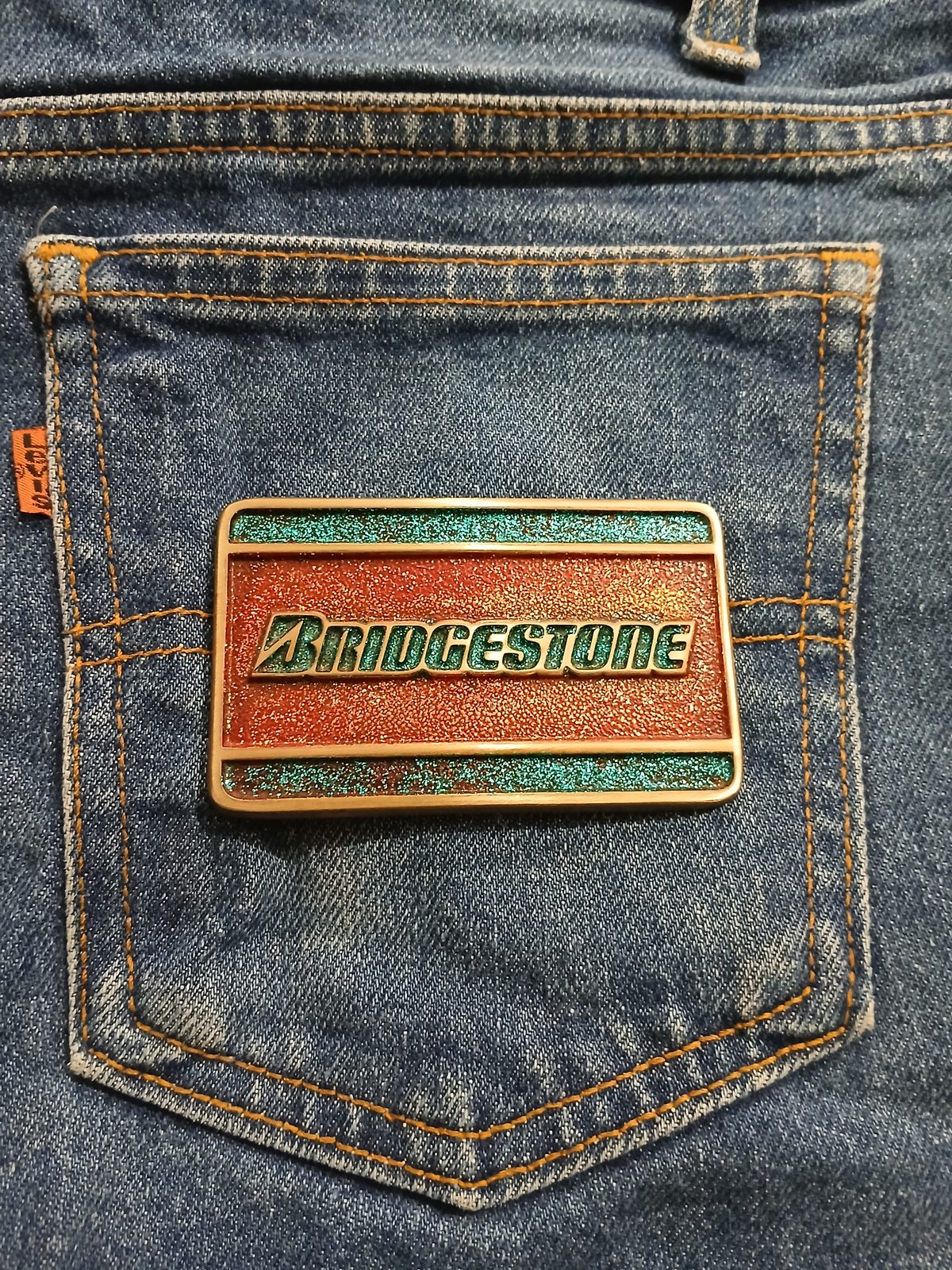 Bridgestone Vintage Belt Buckle – On jeans back pocket Bridgestone vintage belt buckle – on jeans back pocket