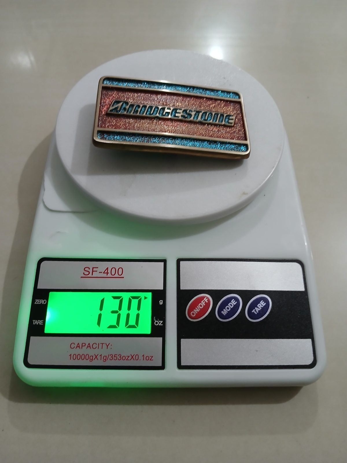Bridgestone Vintage Belt Buckle – On scale showing weight Bridgestone vintage belt buckle – on scale showing weight