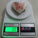 Butterfly Heart vintage belt buckle – on scale showing weight