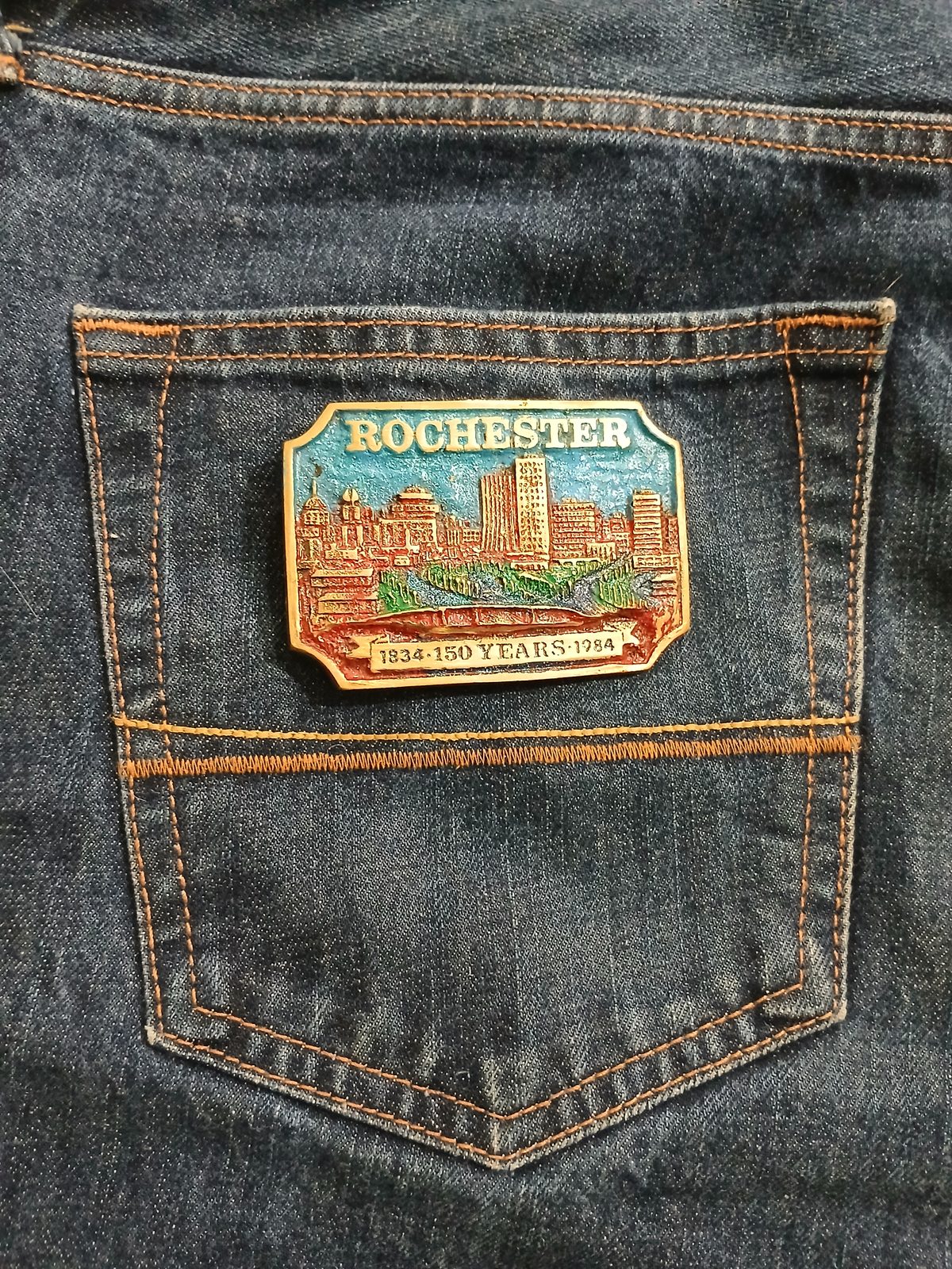 City Skyline 150 Years 1834-1984 Vintage Belt Buckle – On jeans back pocket City Skyline 150 Years 1834-1984 vintage belt buckle – on jeans back pocket