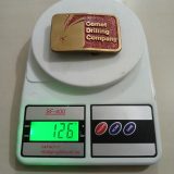 Comet Drilling Company vintage belt buckle – on scale showing weight