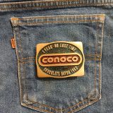 Conoco 1 Year No Lost Time Chocolate Bayou 1982 vintage belt buckle – on jeans back pocket