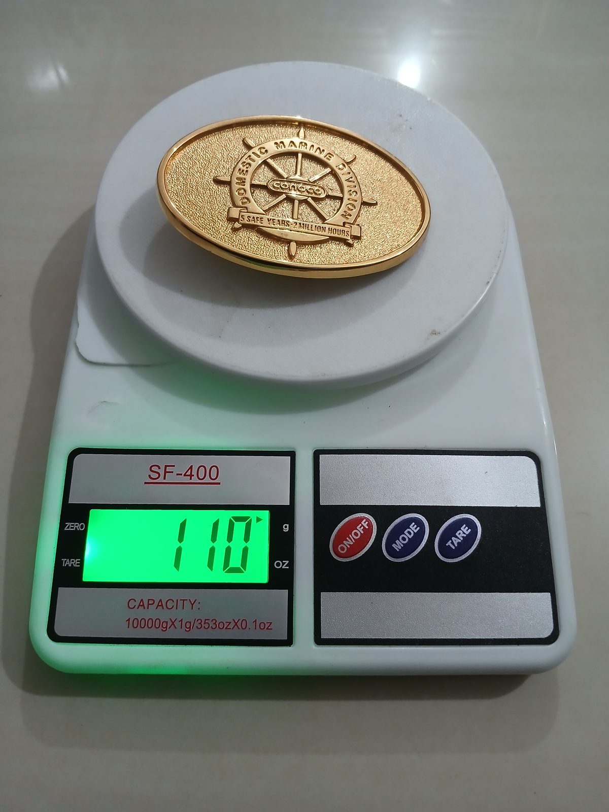 Conoco Domestic Marine Division Vintage Belt Buckle – On scale showing weight Conoco Domestic Marine Division vintage belt buckle – on scale showing weight