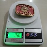 Dallas Cowboys Helmet vintage belt buckle – on scale showing weight