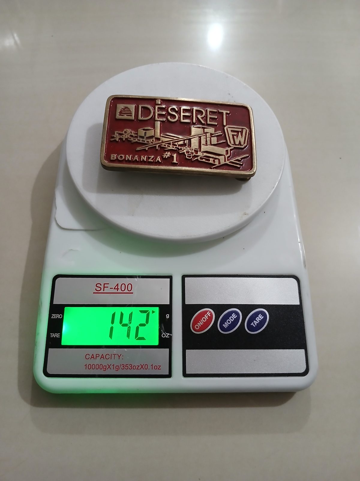 Deseret Bonanza 1 Foster Wheeler Vintage Belt Buckle – On scale showing weight Deseret Bonanza 1 Foster Wheeler vintage belt buckle – on scale showing weight