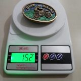 Dirt Biking vintage belt buckle – on scale showing weight