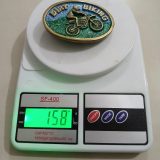 Dirt Biking vintage belt buckle – on scale showing weight