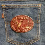 Duck Well Service Inc vintage belt buckle – on jeans back pocket