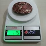 Duck Well Service Inc vintage belt buckle – on scale showing weight