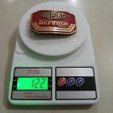 DuPont Automotive Refinish vintage belt buckle – on scale showing weight