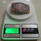 El Paso Safety Comes Natural vintage belt buckle – on scale showing weight