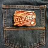 Electrician vintage belt buckle – on jeans back pocket
