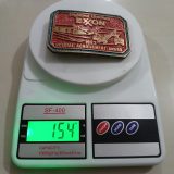 Exxon Highland Uranium 1983 vintage belt buckle – on scale showing weight