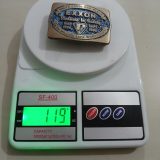Exxon Partners In Safety 1986 vintage belt buckle – on scale showing weight