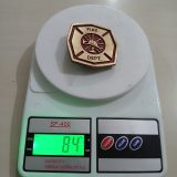 Fire Dept vintage belt buckle – on scale showing weight