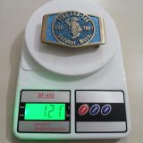 Firetec Gardner Mass 1981 vintage belt buckle – on scale showing weight