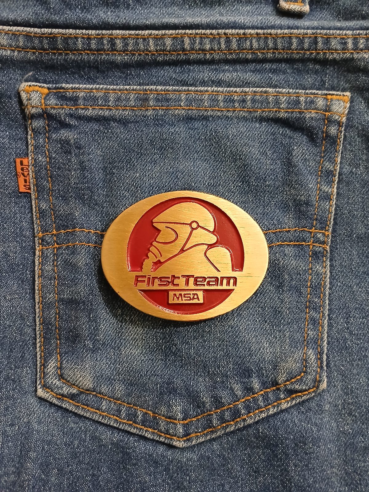 First Team MSA Vintage Belt Buckle – On jeans back pocket First Team MSA vintage belt buckle – on jeans back pocket