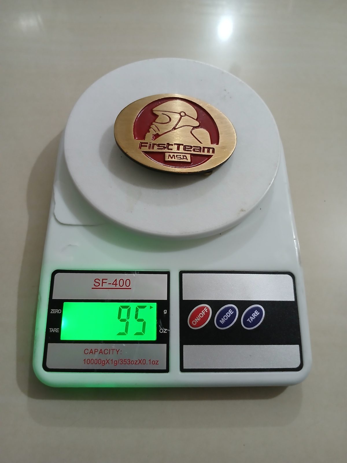First Team MSA Vintage Belt Buckle – On scale showing weight First Team MSA vintage belt buckle – on scale showing weight