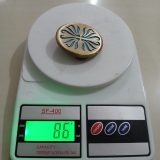 Floral Swirl vintage belt buckle – on scale showing weight