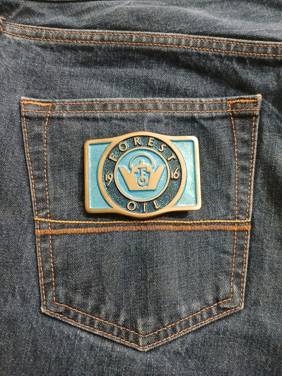 Forest Oil 1916 Vintage Belt Buckle – On jeans back pocket Forest Oil 1916 vintage belt buckle – on jeans back pocket