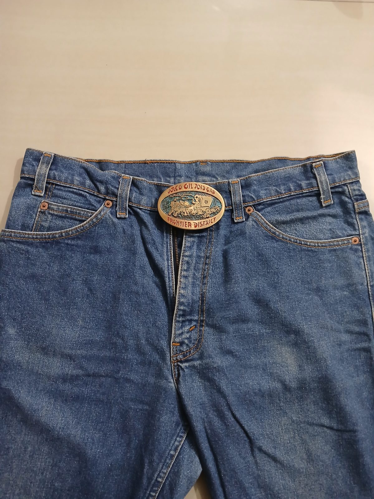 Frontier District Wagon Vintage Belt Buckle – Worn on belt with jeans Frontier District Wagon vintage belt buckle – worn on belt with jeans
