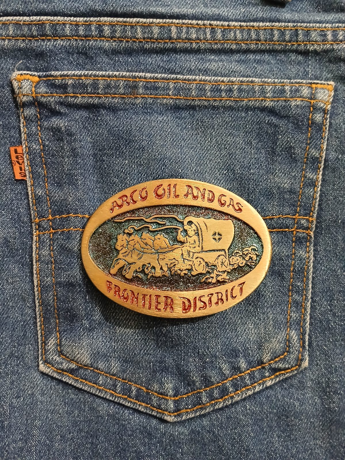 Frontier District Wagon Vintage Belt Buckle – On jeans back pocket Frontier District Wagon vintage belt buckle – on jeans back pocket