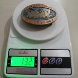 Frontier District Wagon vintage belt buckle – on scale showing weight