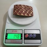 Geometric Pattern vintage belt buckle – on scale showing weight