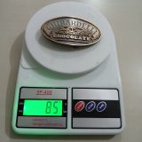 Ghirardelli Chocolate vintage belt buckle – on scale showing weight