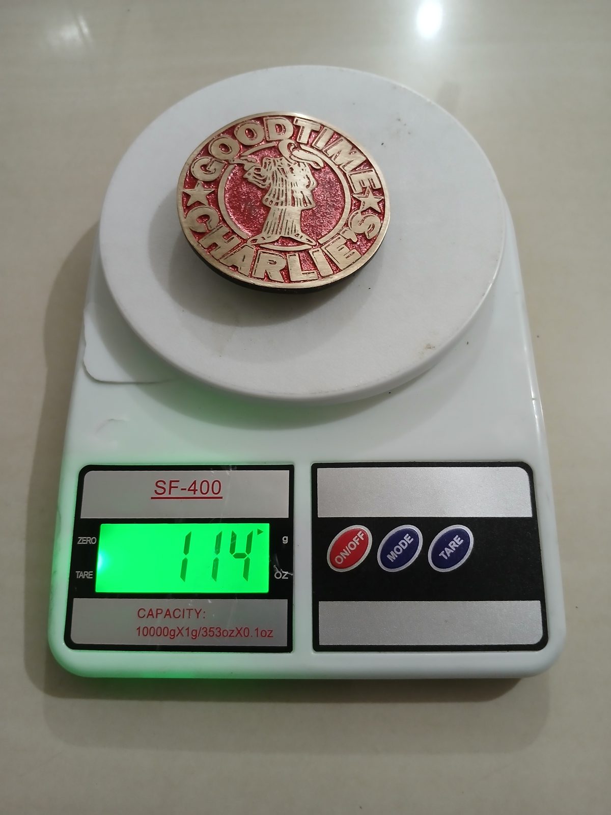 Good Time Charlies Vintage Belt Buckle – On scale showing weight Good Time Charlies vintage belt buckle – on scale showing weight