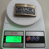 Grace Drilling Company vintage belt buckle – on scale showing weight