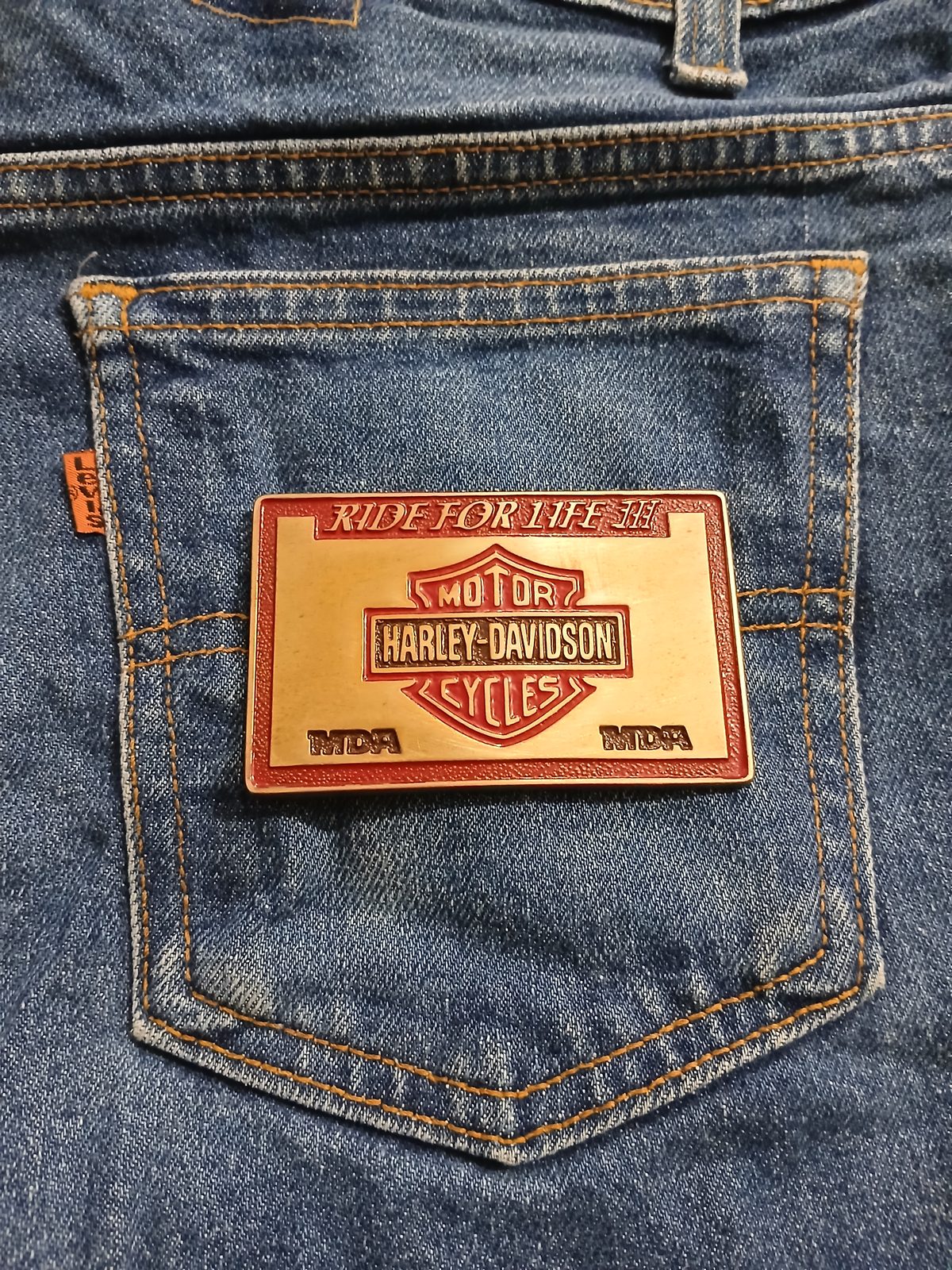 Harley-Davidson MDA Vintage Belt Buckle – On jeans back pocket Harley-Davidson MDA vintage belt buckle – on jeans back pocket